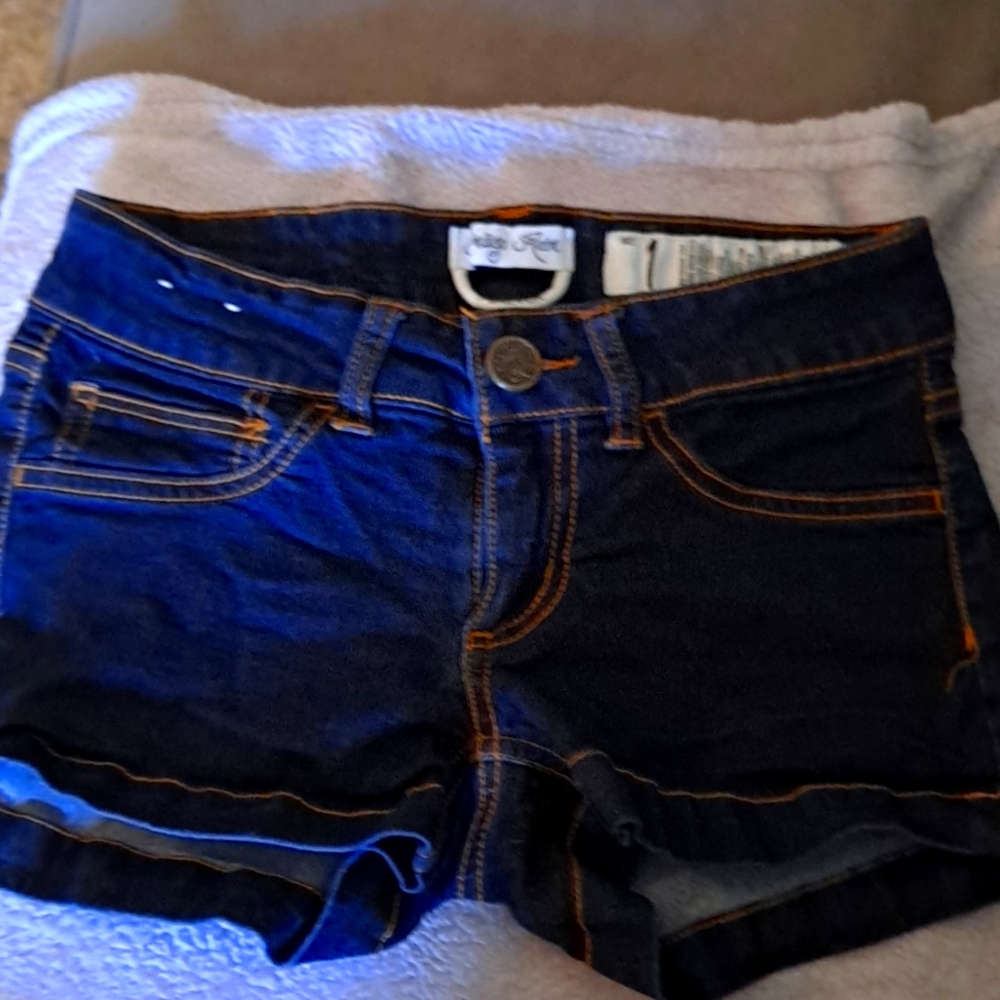 Super stretch low-rise jean shorts size 1 or 0 dark blue with tan stitching